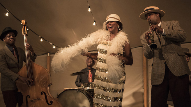 “One of the fun things about the movie is the humor of it, dealing with some of these difficult subjects with humor,” Latifah says about portraying the blues singer Bessie Smith, who not only dealt with tremendous success but also addiction and depression.